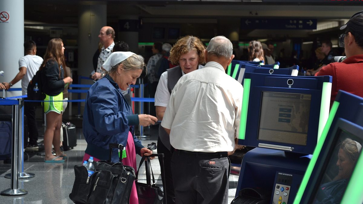 Automated Passport Control kiosks at an airport, the type of self-service kiosk Global Entry members use to clear customs