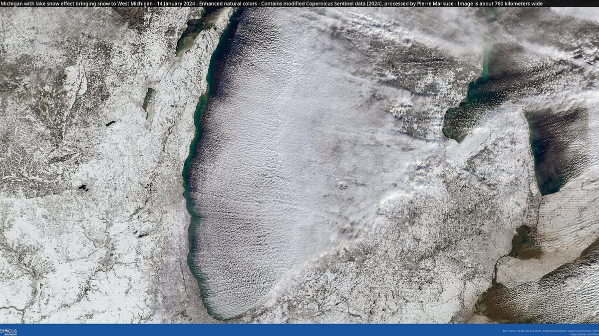 Satellite view of parallel lake effect cloud bands streaming east across Lake Michigan onto a snow-covered western Michigan